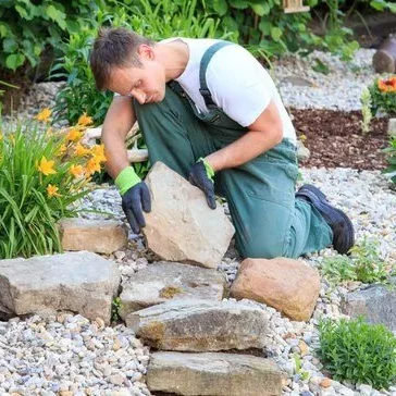 A man laying landscape stone supply